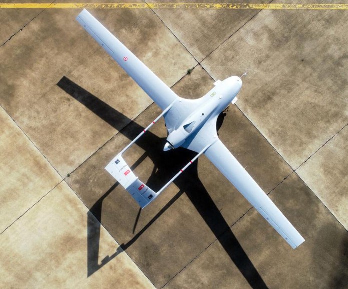 A sleek Bayraktar TB2 unmanned aerial vehicle soaring above a glowing geopolitical map of the world, symbolizing the intersection of advanced technology and international diplomacy.