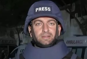 Smoke rising from a targeted building in West Gaza City following a precision drone strike.
