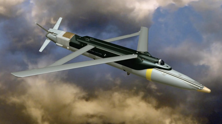 A Ground-Launched Small Diameter Bomb (GLSDB) mid-flight, showing the separation of the M26 rocket booster and the deployment of the GBU-39 glide bomb's wings.