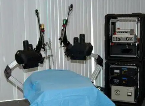 An illustration of a modern combat medic utilizing a semi-autonomous robotic extraction vehicle and advanced bionic prosthetics in a tactical environment.